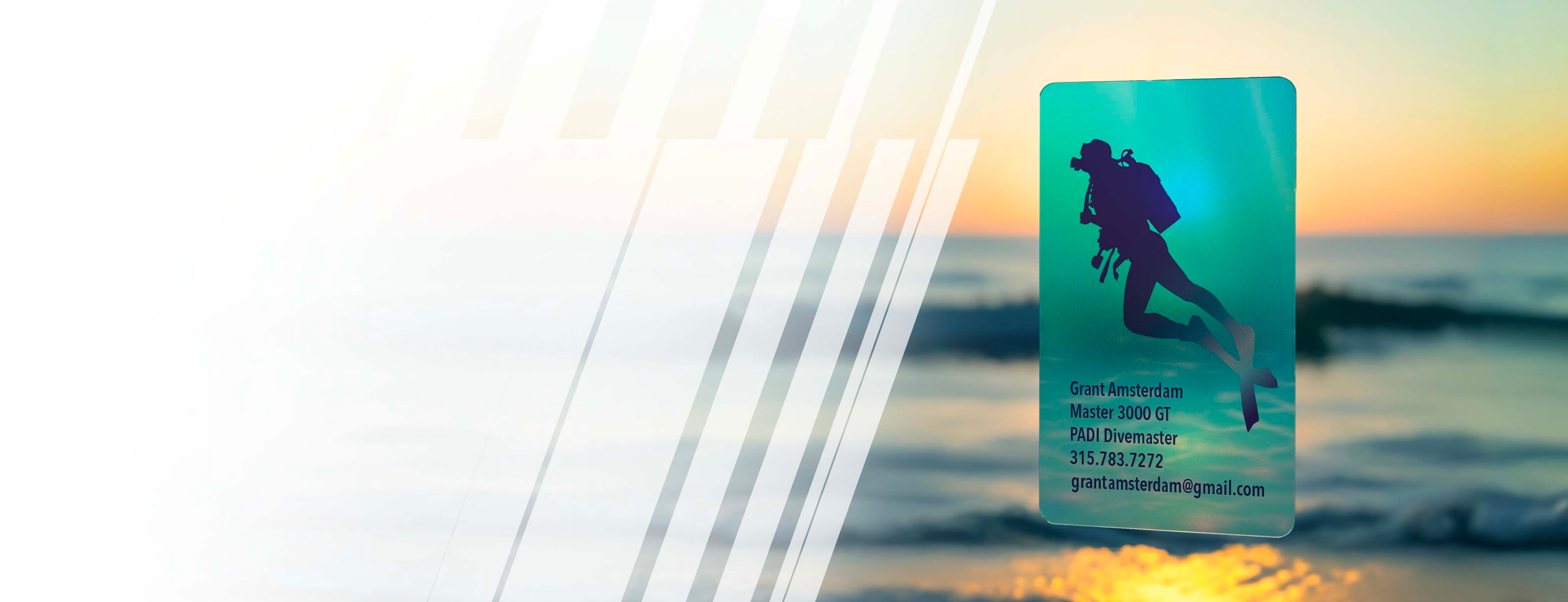Business card with scuba diver design on a beach sunset background