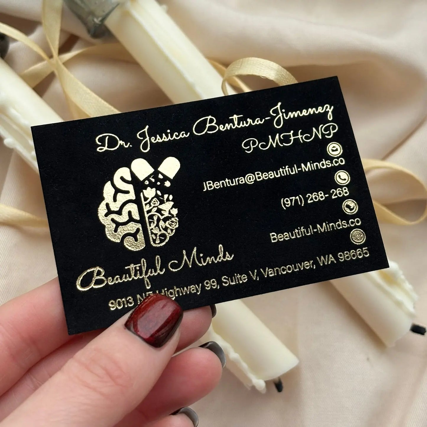Premium thick black cardstock business card with elegant gold foil lettering and custom design.