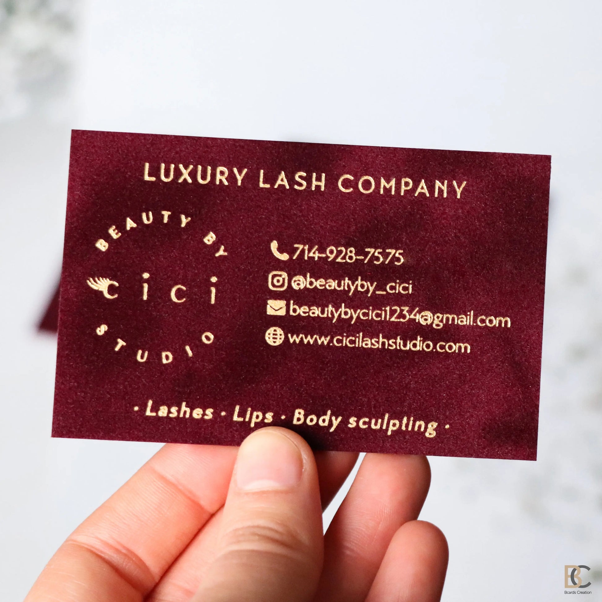 Red velvet multilayer business cards with luxury gold foil stamping. Thick 800 gsm flocked paper with a rich lint texture and elegant gold logo design