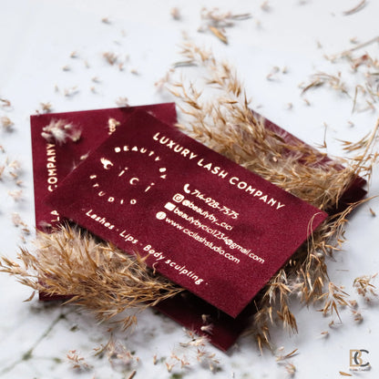 Double-sided red velvet business cards layout. Showcasing the consistent flocked texture and gold foil design on both sides of the luxury cards